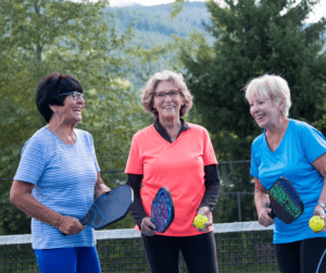 Senior women playing pickleball