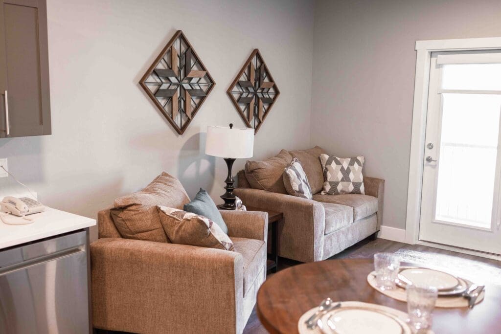 CU7A6972-1024x683 - Grace Management Interior image of The Summit of Coralville apartment living room and dining room.