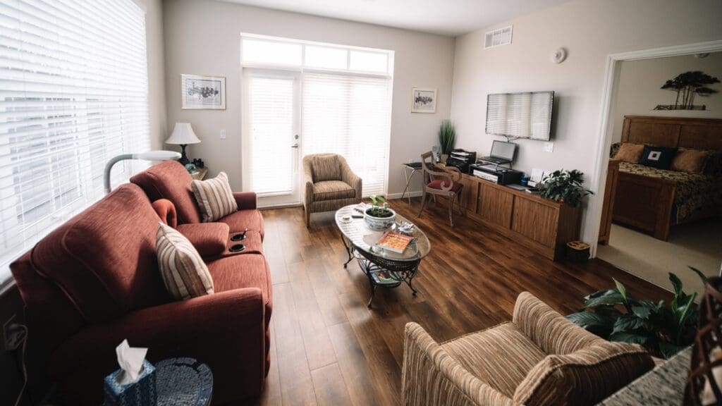 Interior image of a resident's living room with comfortable furniture and natural lighting.