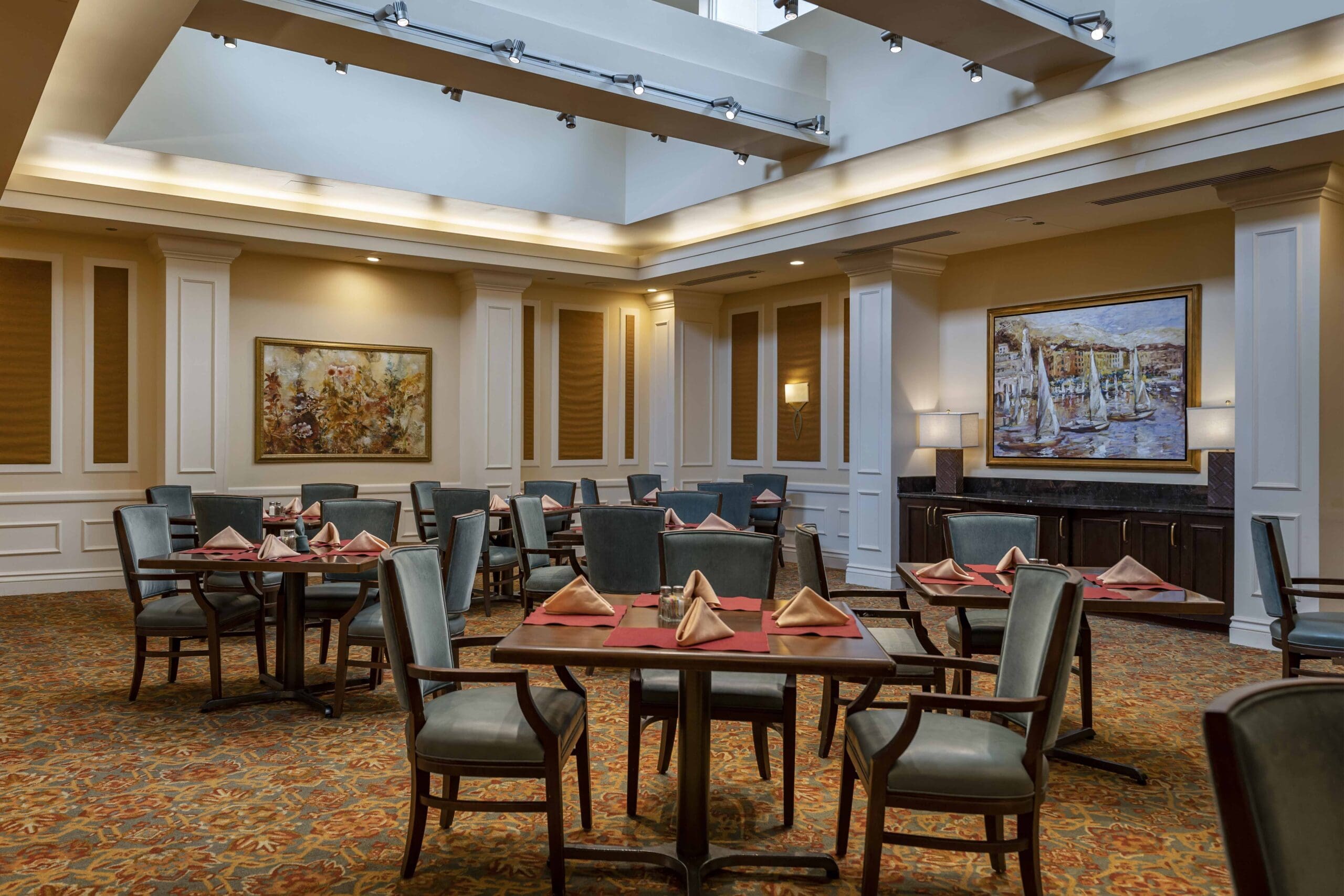 The Hallmark dining room with comfortable seating and flatware.